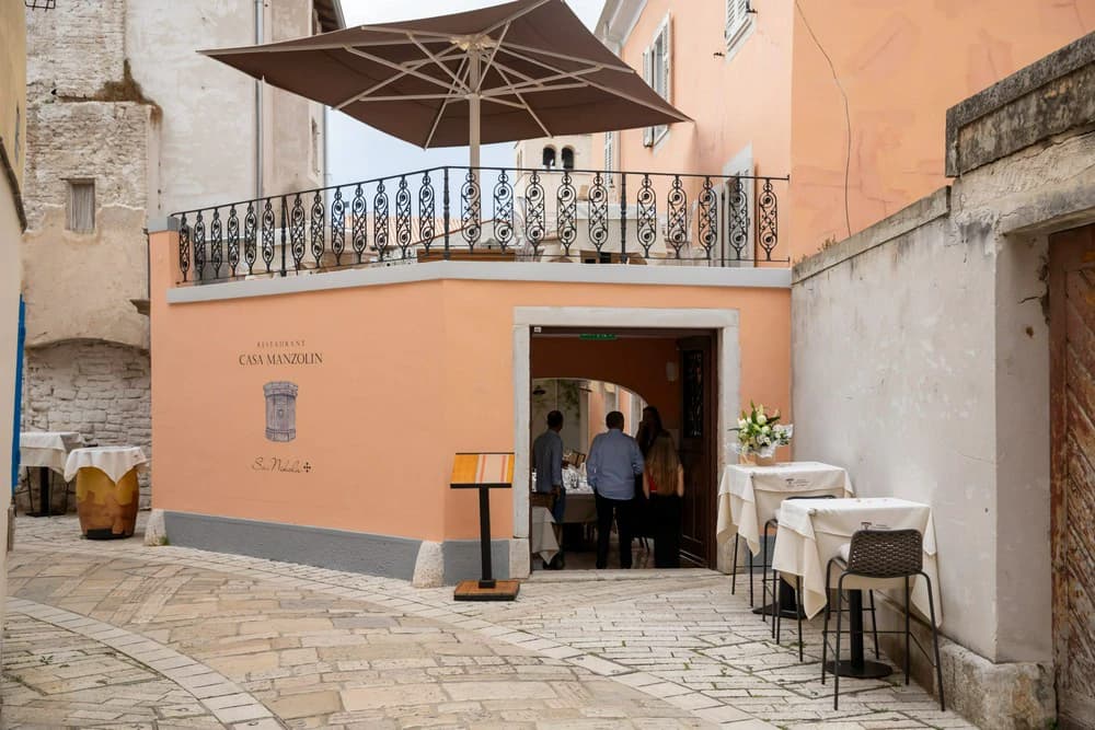 Restaurant Casa Manzolin interior view showing traditional architecture and modern dining space